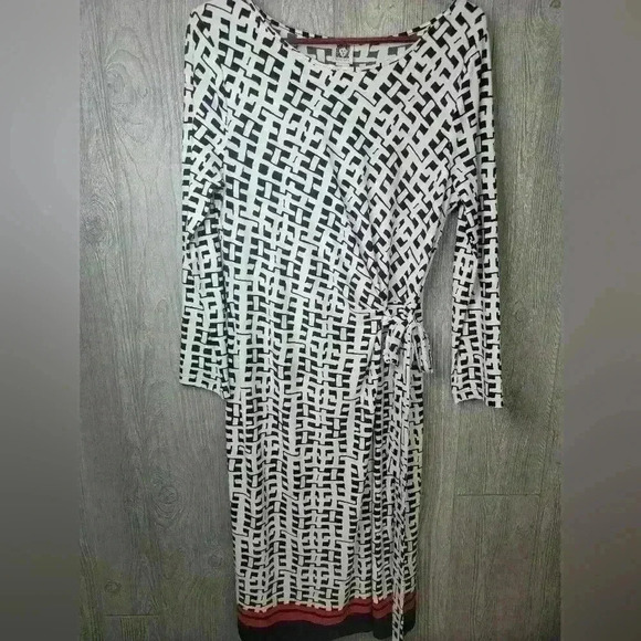 Ann Klein black and white design dress with orange strip stripe on bottom. - Picture 1 of 6